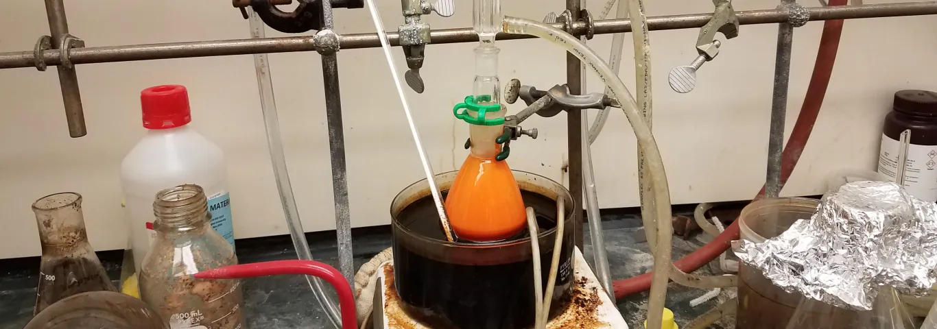 Orange reaction mixture in oil bath